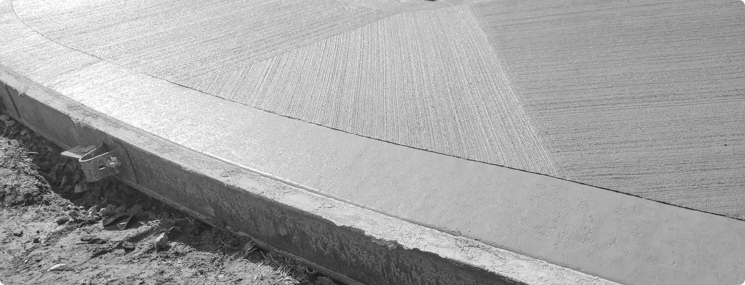 freshly poured and finished concrete walkway